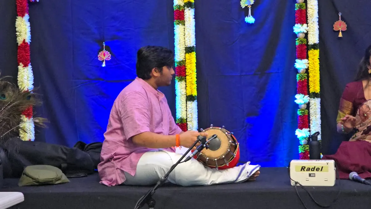Performance with flower garlands backdrop